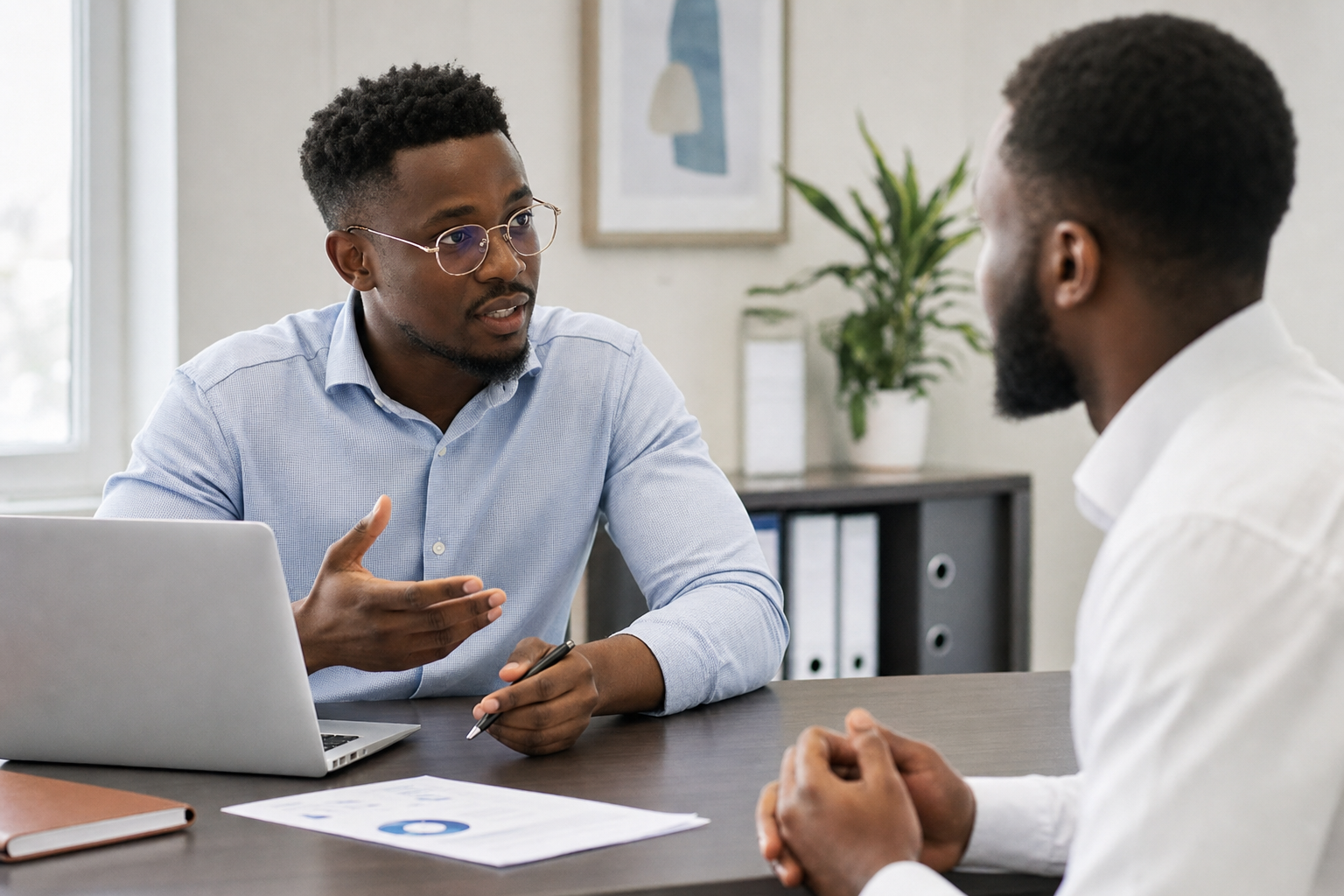 Ghanaian professional consultant in a meeting with a client